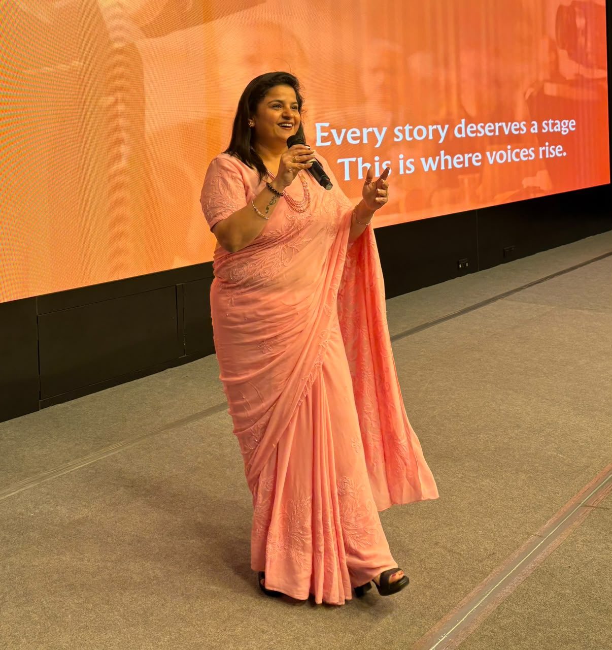Shipra speaking confidently on stage